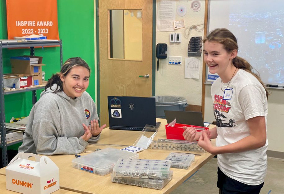 Two female students laughing during FTC programming