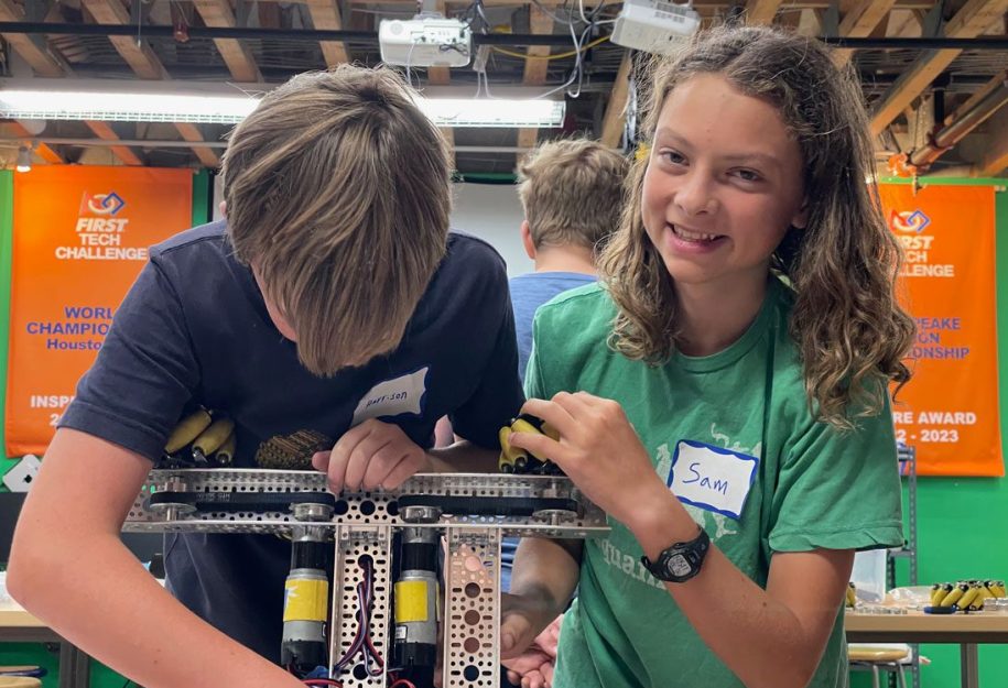 Two male students building an FTC robot.